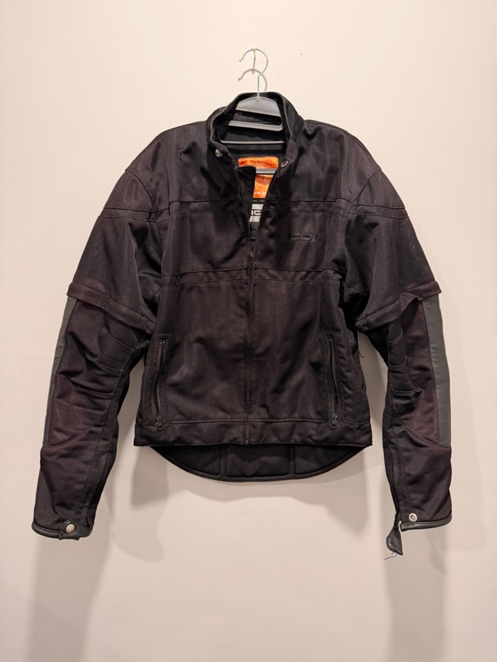 ICON Black Motorcycle Jacket with Orange Interior Label